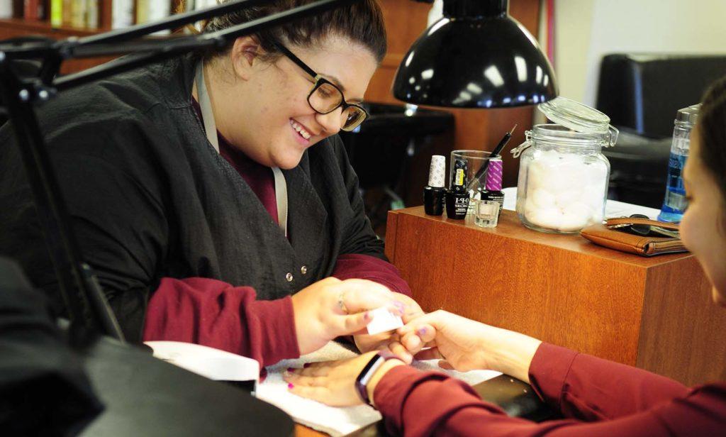 woman getting nails done